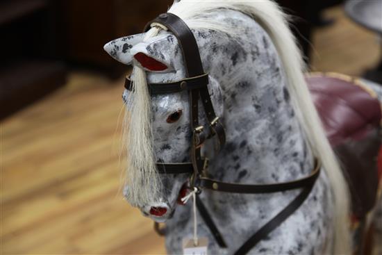 An Edwardian trestle base painted rocking horse, L.4ft 8in.